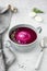 chilled beetroot soup with sour cream and dill in a gray plate