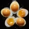 Chilled Eggs Cut In Half On Black Surface - Uhd Stock Photo