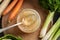 Chilled jellied beef bone broth on a spoon, with fresh vegetables