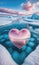 Chilled Romance: A Frozen Pink Heart Floating in an Icy Ocean Beneath a Blue Cloudy Sky