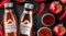 Chilli hot sauce product ads and chili peppers in fire shape with burning fire effect on black background, 3d illustration