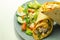 Chilli tortilla wrap with chicken breast, peppers, cucumber and mix salad