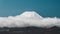 Chilling view of Mount Ruapehu over a cloud in New Zealand