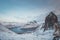 Chilling view from Mount Segla of the village of Fjordgard and the lake around it. Rocky mountains on the Senja peninsula in