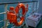 CHILOE, CHILE - SEPTEMBER, 27, 2018: Outdoor view of orange lifesaver inside of ferry in the mainland of Chile