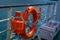 CHILOE, CHILE - SEPTEMBER, 27, 2018: Outdoor view of orange lifesaver inside of ferry in the mainland of Chile