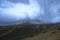 Chimborazo, barely visible through the dangerous dark thunderclouds surrounding the top