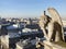 Chimera overlooking the skyline of Paris