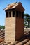 Chimney built in brick on the roof