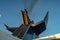 Chimney of a ferry boat with smoke and blue sky