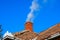 Chimney on house with smoke