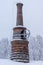 Chimney from an old iron works or steel mill in winter