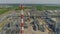 Chimney and production towers at refinery plant aerial view