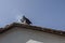 Chimney with smoke on traditional house in ancient residential district Varosha