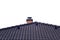 Chimney on tiled roof with isolated sky