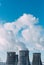 Chimney towers of nuclear power plant the background of blue sky. Copy space