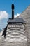 Chimney on a typical shingle roof of swiss rural areas