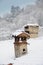 Chimneys covered with snow winter landscape