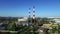 Chimneys on power plant on modern city landscape. Drone view industrial pipe