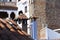 Chimneys, roofs, blue and red colors in the Moroccan village of