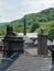 Chimneys and roofs of traditional stone build houses and mills typical of west yorkshire small towns and villages