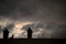 chimneys silhouettes an crow silhouettte  on dramatic sky by sunset background