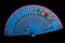 China blue hand fan isolated on black