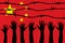 China flag behind barbed wire fence. Group of people hands. Freedom and propaganda concept