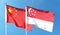 China flag and Singapore flag on cloudy sky. waving in the sky