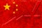 China flag with yuan chinese currency symbol and downside graph on rustic background