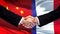 China and France handshake, international friendship relations, flag background