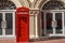 China, Hainan Island, Sanya bay - Sanya city. Traditional red telephone box in London public phone - a symbol