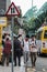 China, Macao, two teenagers passing by the bus station