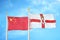 China and Northern Ireland two flags on flagpoles and blue cloudy sky