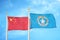 China and Northern Mariana Islands two flags on flagpoles and blue cloudy sky