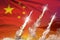China nuclear warhead launch - modern strategic nuclear rocket weapons concept on sunset background, military industrial 3D