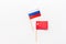 China-Russia relations. Country cooperation. Russian and Chinese flags on white background top view copy space. Flat lay, overhead