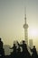 China Shanghai silhouettes of people against city skyline (Oriental Pearl TV Tower)