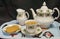 China tea set with cup of tea and biscuits