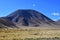 China, Tibet. China, Tibet. Mountain landscape on the way to lake Mershung Merchong in summer. Mountain that resembles a human f