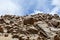 China, Tibet. Summer mountain landscape. Scattering of stones