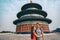 China travel happy couple tourists posing for portrait in front of Temple of Heaven, Beijing city. chinese famous