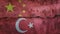 China and Turkey flag on cracked wall background. Economics, politics conflicts, war concept texture background