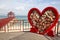 China  Wuzhizhou Island - December 2  2018: Wuzhizhou Island. Symbol of love Valentines and hearts hang on a big heart  editorial