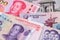China Yuan Renminbi currency with North Korean Won banknotes close up image.