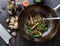 Chineese noodles stir-fry preparation in a wok, close view