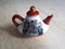The Chinese antiquarian ceramic teapot is made in traditional style.