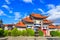 Chinese Arched Entrance under Blue Sky and White Cloud