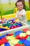 Chinese baby playing puzzle