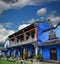 Chinese blue mansion under cloudy sky